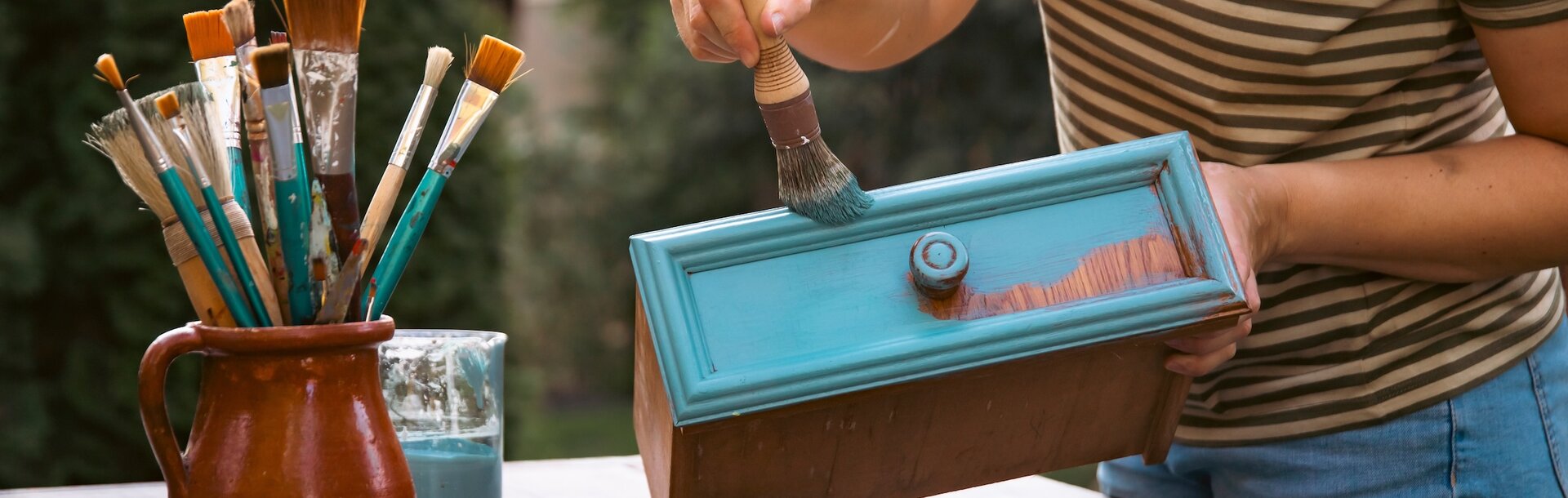 2493430637 | Mid woman painting furniture outdoors at home, relocation and diy concept. 2493430637 | Mid woman painting furniture outdoors at home, relocation and diy concept.